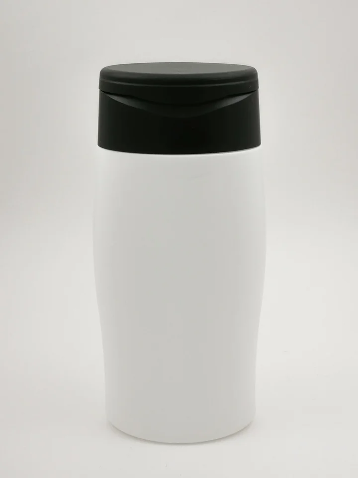 White cylindrical bottle with a black flip-top cap on a light background.
