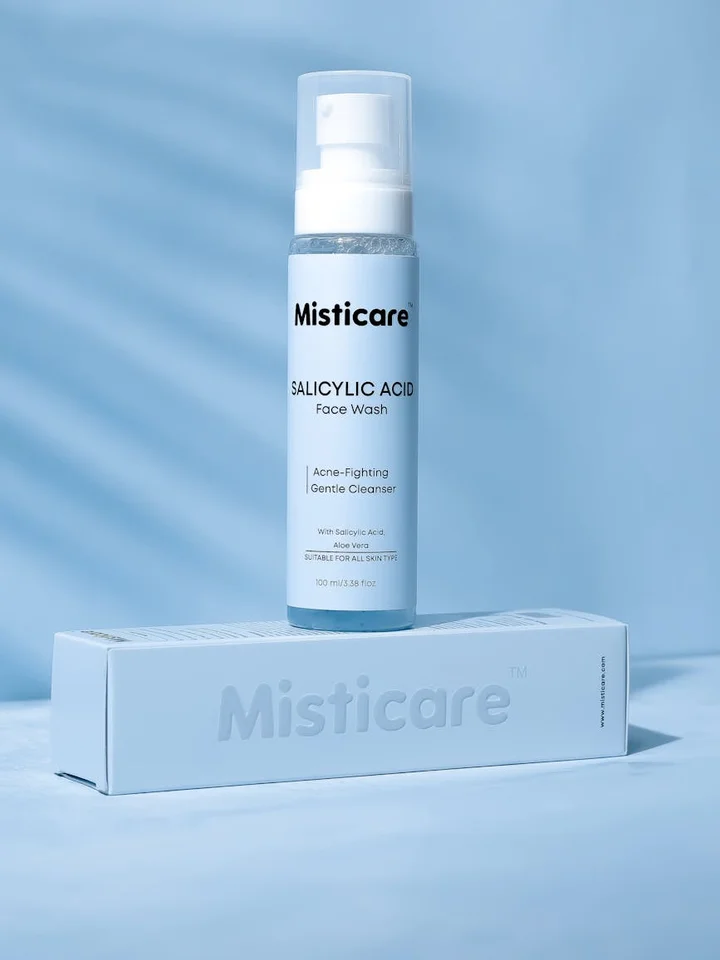 Misticare Salicylic Acid Face Wash bottle with a pump cap placed on a matching box against a light blue background