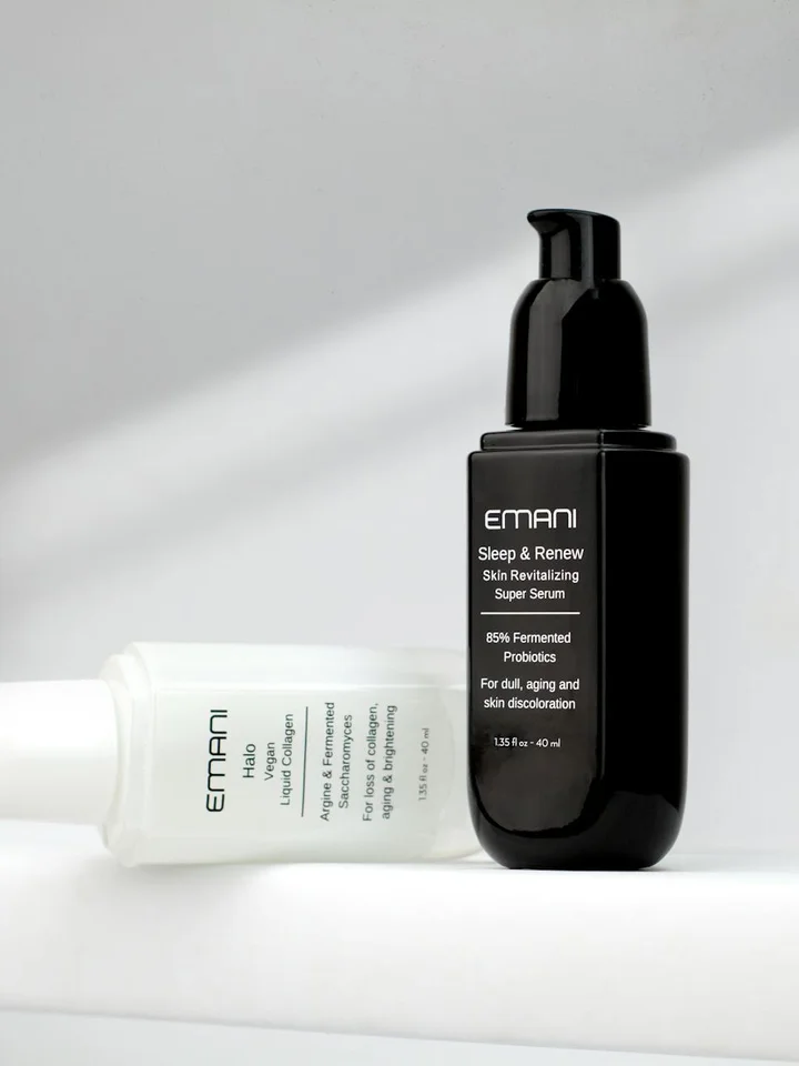 Two skincare bottles on a white surface — a black pump bottle and a white tube — illustrating products considered in mixing adapalene with glycolic acid (AHA) or salicylic acid (BHA).