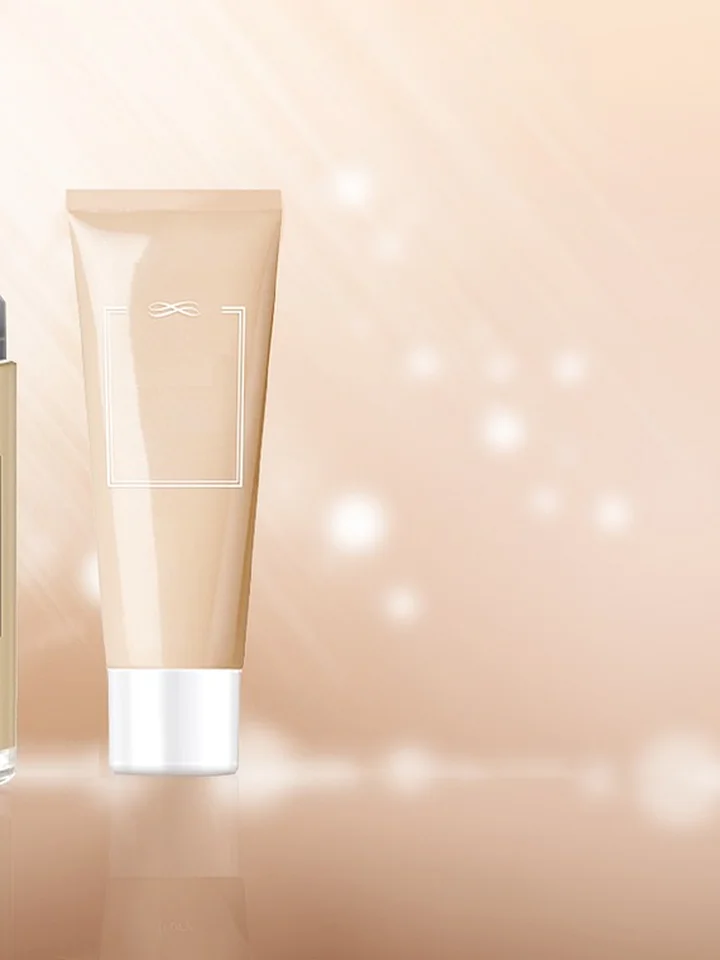 Two skincare tubes on a soft peach background with bokeh light effects.
