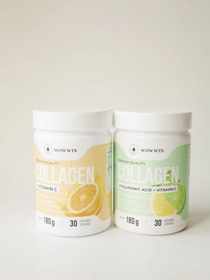 Two collagen peptide jars on a white surface, one labeled with Vitamin C and the other with Hyaluronic Acid + Vitamin C, photographed in soft light.