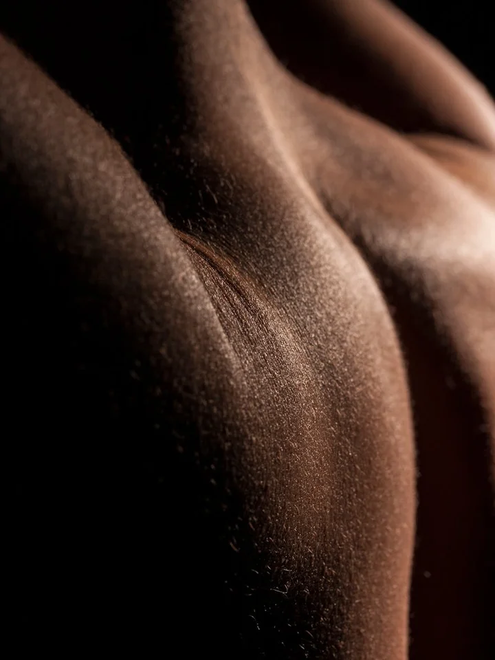Close-up of textured skin with warm lighting, illustrating safe exfoliation concepts.